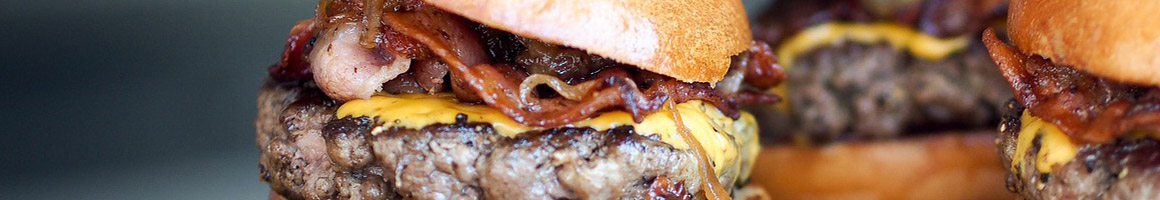 Eating Burger Fast Food at Omega Drive-In restaurant in Orange, CA.